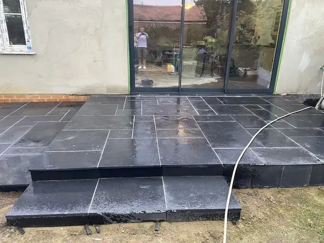 Dark porcelain patio and step outside sliding doors