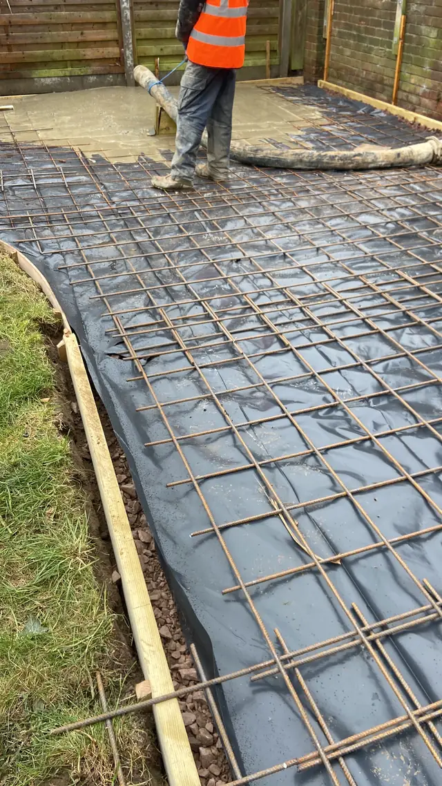 Steel mesh reinforcement laid over membrane before a concrete pour